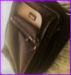 Tumi, suitcase, switched luggage